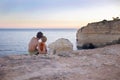 Happy children, playing on the beach on sunset, kids running in the water in the ocean Royalty Free Stock Photo