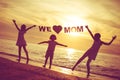 Happy children playing on the beach at the sunset time. Royalty Free Stock Photo