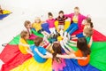 Happy children playing circle games with teacher Royalty Free Stock Photo