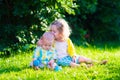 Happy children playing in the garden with toy balls Royalty Free Stock Photo