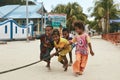 Happy children playing rope pulling game in Indonesian village