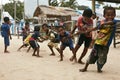 Happy children playing rope pulling game in Indonesian village