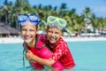 Happy children playing in the sea. Kids having fun outdoors. Summer vacation and healthy lifestyle concept Royalty Free Stock Photo