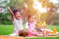 Happy children playing in summer park on warm sunny fall day. Healthy lifestyles concept