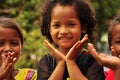 Happy children playing with their hands.