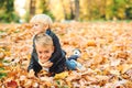 Happy children playing together in autumn park. Cute little brothers on a walk in beautiful autumn day. Happy and healthy Royalty Free Stock Photo