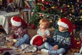 Children playing  By Tree On Christmas Morning Royalty Free Stock Photo