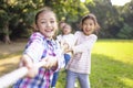 Happy Children playing tug of war at the park Royalty Free Stock Photo