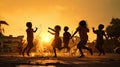 Happy children playing in a water in the slums on the street at sunset Royalty Free Stock Photo