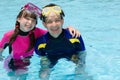 Happy children in pool Royalty Free Stock Photo
