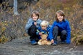 Happy children, posing in front of beautiful waterfall Svartifoss in Skaftafell national park i Royalty Free Stock Photo