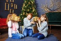 Happy children received presents for Christmas. The concept of holidays, Merry Christmas, holidays and family Royalty Free Stock Photo