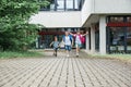 Happy children run on the background of the school or from school. The beginning of the school year, the end of the lessons. The Royalty Free Stock Photo