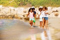 Happy children running on the beach in summer Royalty Free Stock Photo