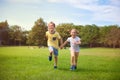Happy children running in park Royalty Free Stock Photo