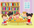 Happy children`s activity in the kindergarten, cute kids with playing toy, Group of happy school child in classroom, education