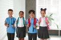 Happy children in school uniform with backpacks Royalty Free Stock Photo