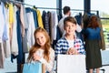 happy children with shopping bags in boutique