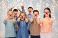 Happy children showing thumbs up at red nose day Royalty Free Stock Photo