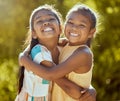 Happy children, sisters and girl friends hug for love, care and bond in sun park, summer garden and backyard in outdoor Royalty Free Stock Photo