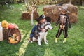 Happy children with skeleton and witch costume holding and eating candies. Trick-or-treat child concept. Children in