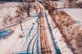 Happy children sledding down the slide, view of children from above, fun winter vacation