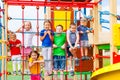 Children at school yard playground climbing together Royalty Free Stock Photo