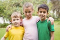 Happy children standing together with arms around each other Royalty Free Stock Photo