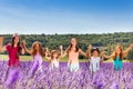 Happy children standing together in lavender field Royalty Free Stock Photo