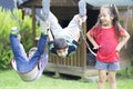 Happy children swinging Royalty Free Stock Photo
