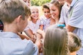 Happy children team heaping hands in summer Royalty Free Stock Photo