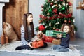 Happy children unpack gifts for Christmas. The concept of Christ Royalty Free Stock Photo