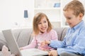 Happy children using laptop Royalty Free Stock Photo