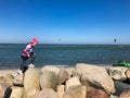 Happy children walking and looking water sports at a beach Royalty Free Stock Photo