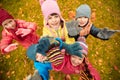 Happy children waving hands in autumn park Royalty Free Stock Photo