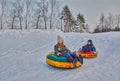 Happy children on a winter sleigh ride Royalty Free Stock Photo