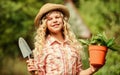 Happy childrens day. Happy childhood. Ranch girl. Planting plants. Little kid hold flower pot. Spring country works Royalty Free Stock Photo