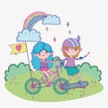 Happy childrens day, cute boy and girl riding bike and skateboard in the park Royalty Free Stock Photo