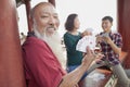 Happy Chinese Family Playing Card In Jing Shan Park, Showing Cards Royalty Free Stock Photo