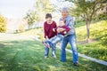 Happy Chinese Grandparents Having Fun with Their Mixed Race Grandson Outside Royalty Free Stock Photo