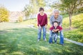 Happy Chinese Grandparents Having Fun with Their Mixed Race Grandson Outside Royalty Free Stock Photo