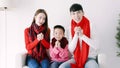 happy chinese new year. asian family showing congratulation gesture at home Royalty Free Stock Photo