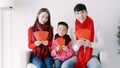 happy chinese new year. asian family showing red envelope for celebrating chinese new year Royalty Free Stock Photo