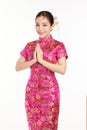 Happy Chinese new year, Beautiful young Asian woman wearing traditional cheongsam qipao dress with gesture of congratulation Royalty Free Stock Photo