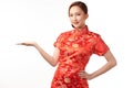 Happy Chinese new year, Beautiful young Asian woman wearing traditional cheongsam qipao dress with gesture of introduce isolated Royalty Free Stock Photo