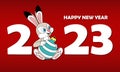 Happy Chinese new year 2023 with cute rabbit sitting and holding christmas ball. The rabbit is the symbol of 2023. New Year Royalty Free Stock Photo