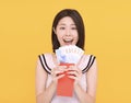 Happy chinese new year. surprised young woman watching the red envelope and money Royalty Free Stock Photo