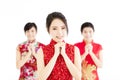 Happy chinese new year.woman with congratulation gesture