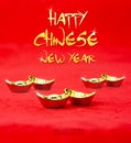 Happy Chinese new year word with golden texture with golden ingots on red felt fabric