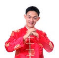 Happy Chinese new year.Young Asian man with gesture of congratulation Royalty Free Stock Photo